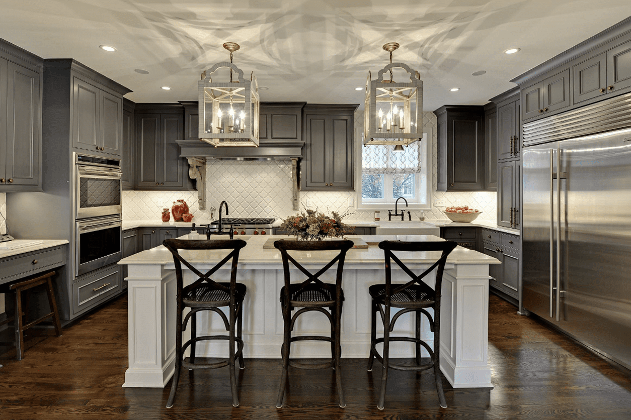 A beautiful kitchen with chairs and lights