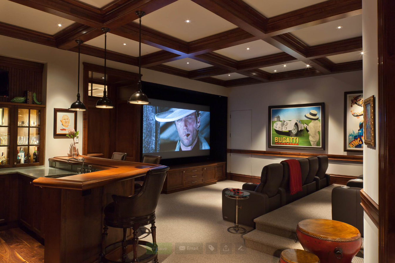Screened media room with tiered seating and posters