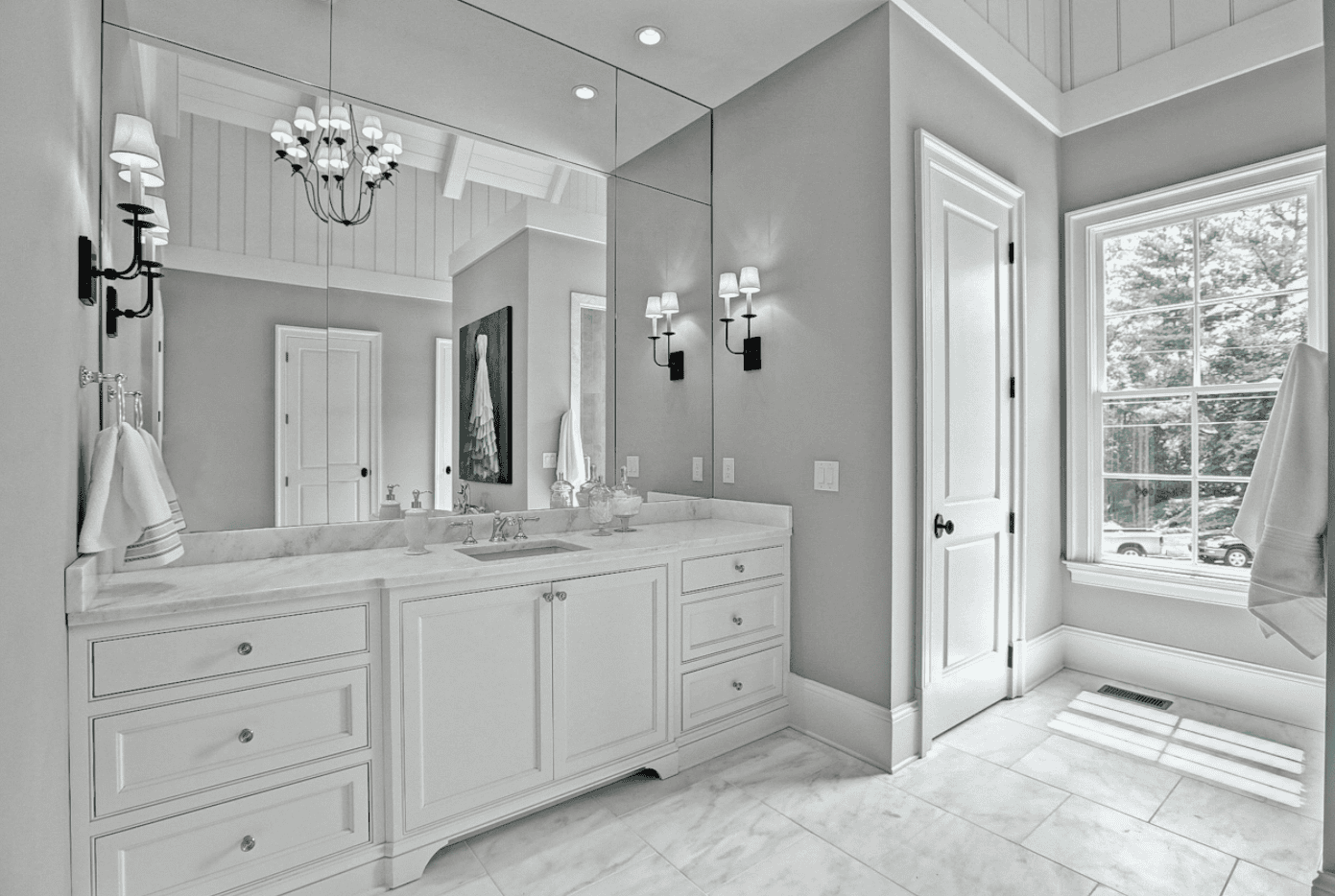 Elegant bathroom with double sinks and large mirrors.